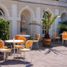 Tables and chairs set up in front of the orangery