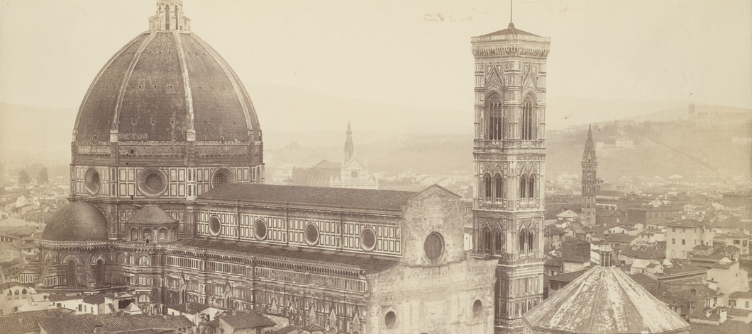 A sepia-toned photograph showing the cathedral and bell tower in Florence