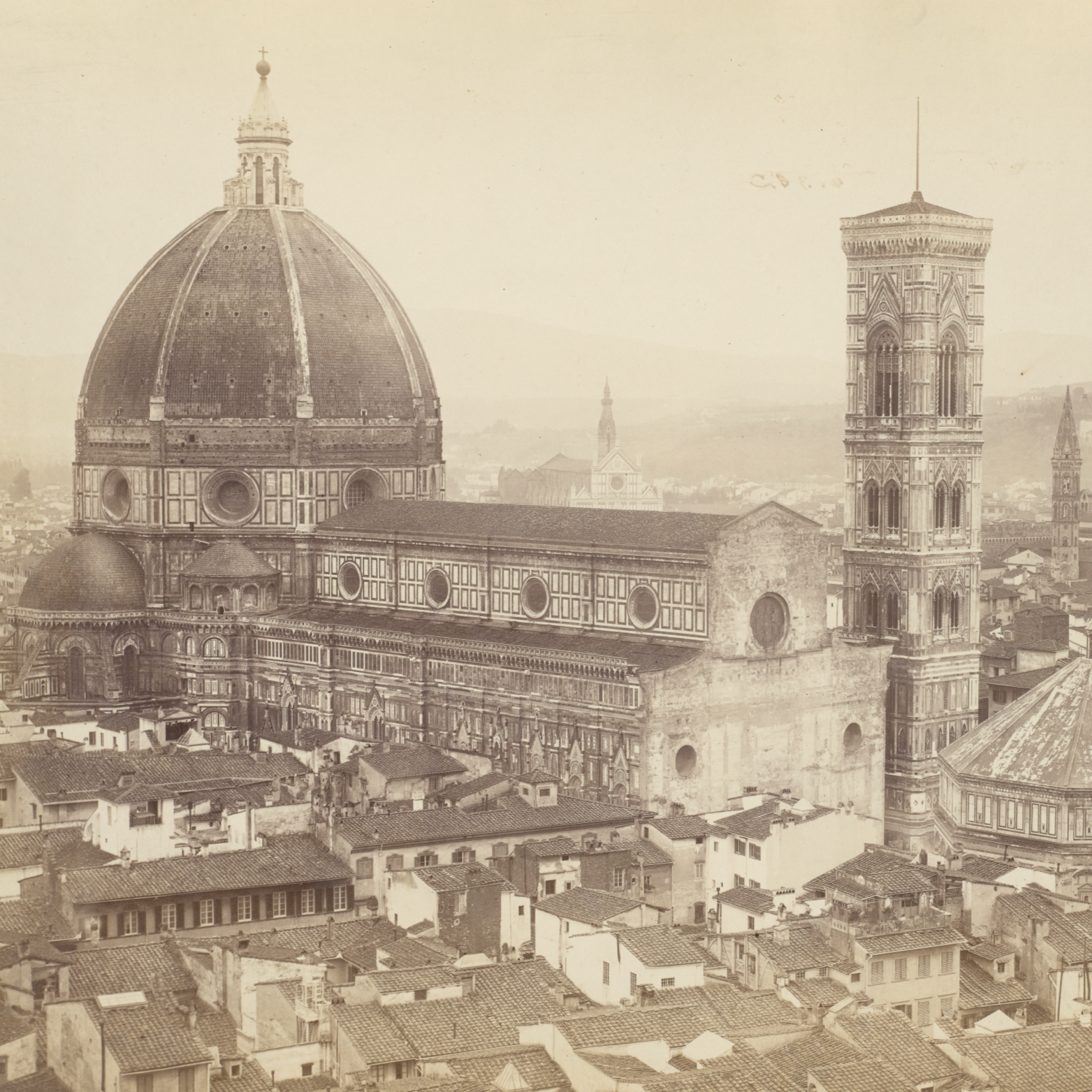 A sepia-toned photograph showing the cathedral and bell tower in Florence